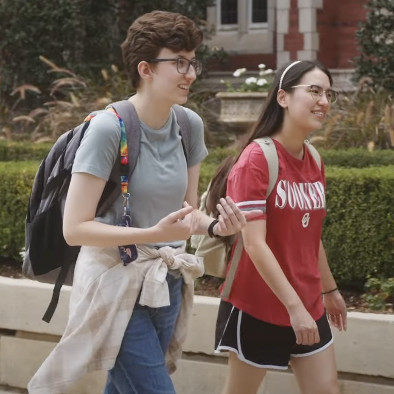 Grace Tisher and Sage Abbott walking across campus