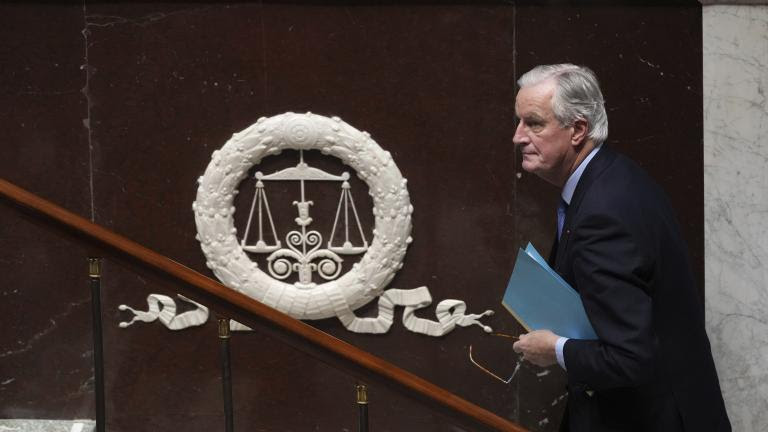 French Prime Minister Michel Barnier arrives to address the National Assembly prior to a vote on a no-confidence motion that could bring him down and his cabinet for the first time since 1962, Wednesday, Dec. 4, 2024 in Paris. (AP Photo/Michel Euler)