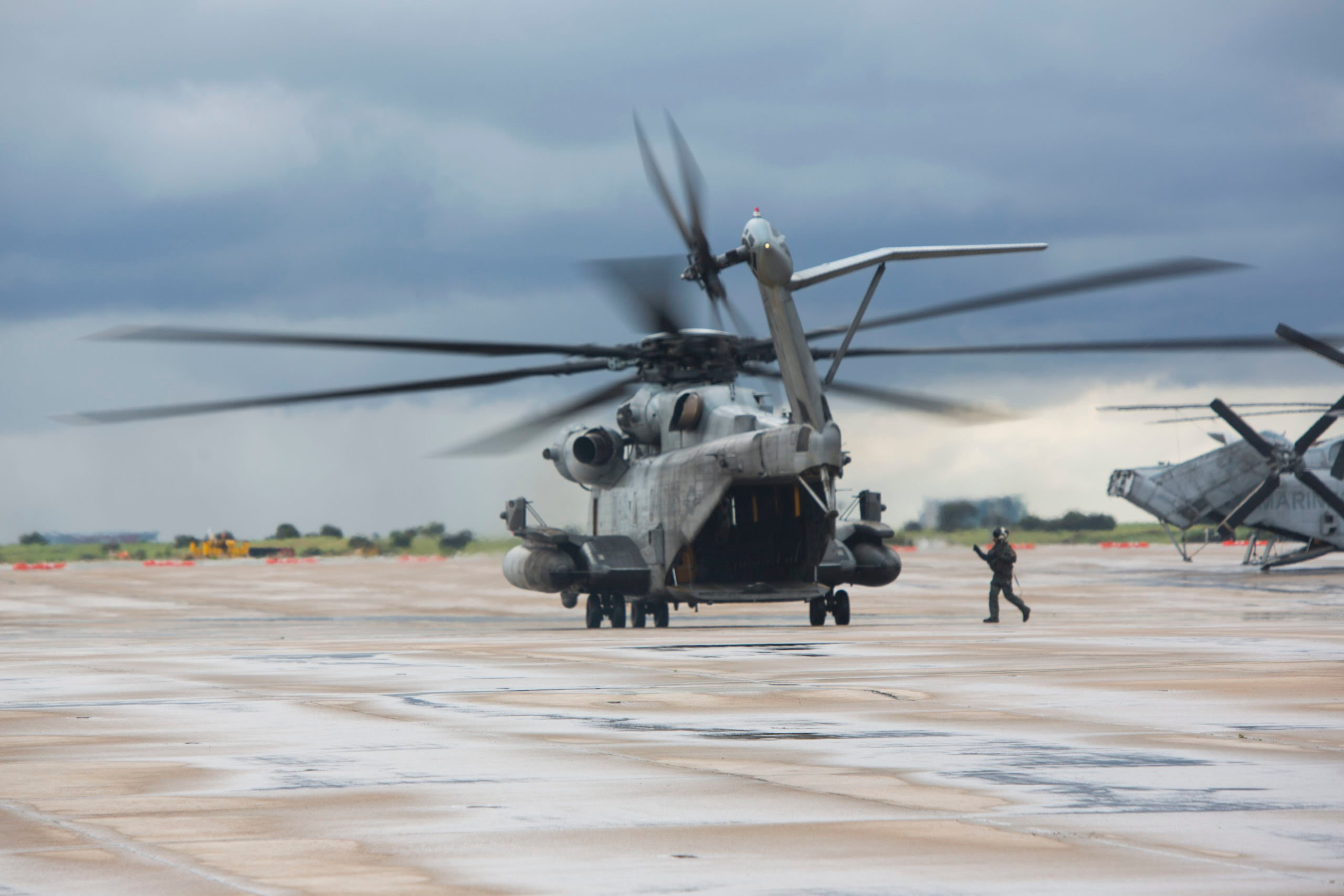 U.S. Marines with Marine Heavy Helicopter Squadron 462, Marine Aircraft Group 16, 3rd Marine Aircraft Wing, enforce precautionary measures during the maintenance of CH-53E Super Stallions on Marine Corps Air Station Miramar, Calif., March 17, 2020. The purpose of these measures is to mitigate the spread of COVID-19 while continuing to perform mission essential tasks.