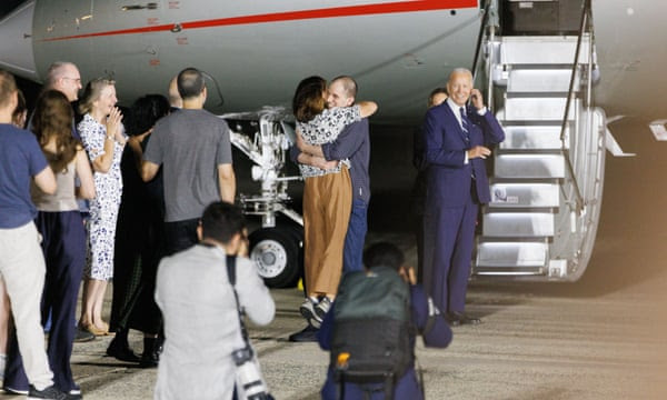 Wall Street Journal reporter Evan Gershkovich greets family members at Joint Base Andrews, Maryland on August 1, 2024.