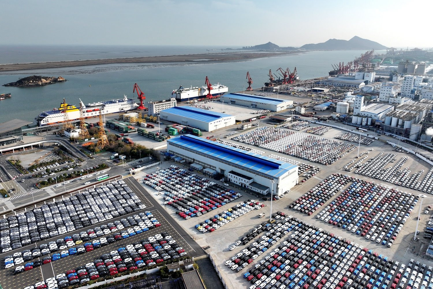 Cars wait to be loaded onto ships for export in Lianyungang, China, on Dec. 12.