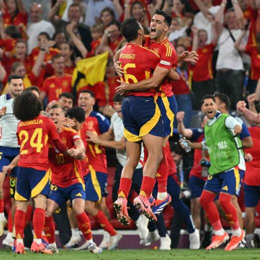 Spain's midfielder #06 Mikel Merino and Spain's midfielder #16 Rodri celebrate at the end of the UEFA Euro 2024 semi-final football match between Spain and France at the Munich Football Arena in Munich on July 9, 2024. (Photo by MIGUEL MEDINA / AFP)