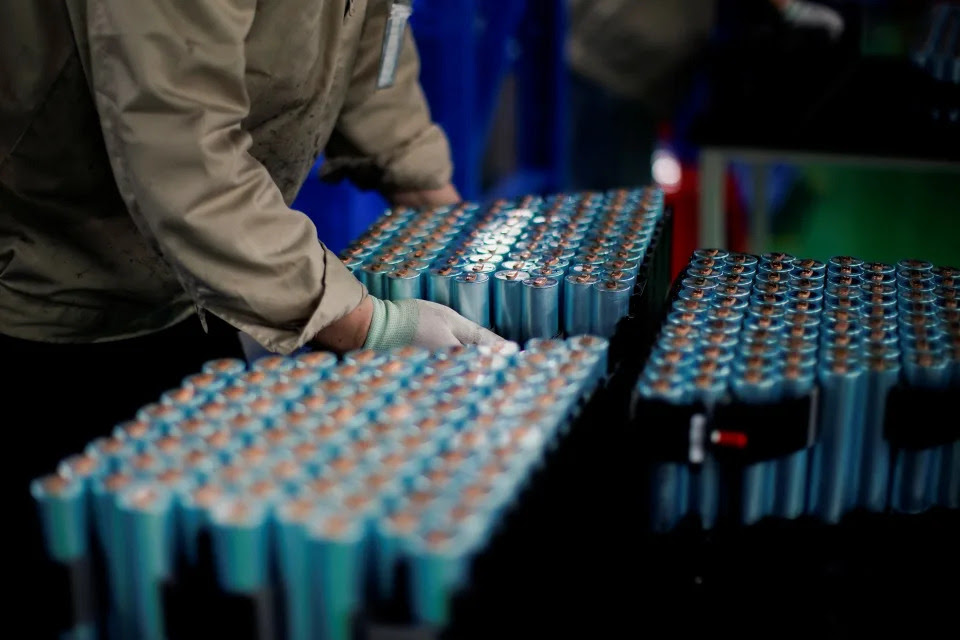 An employee works on the production line of electric vehicle (EV) battery manufacturer Octillion in Hefei, Anhui province, China March 30, 2021. Picture taken March 30, 2021. REUTERS/Aly Song