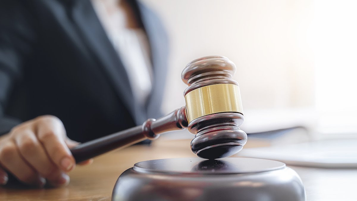 Woman of color holding a gavel