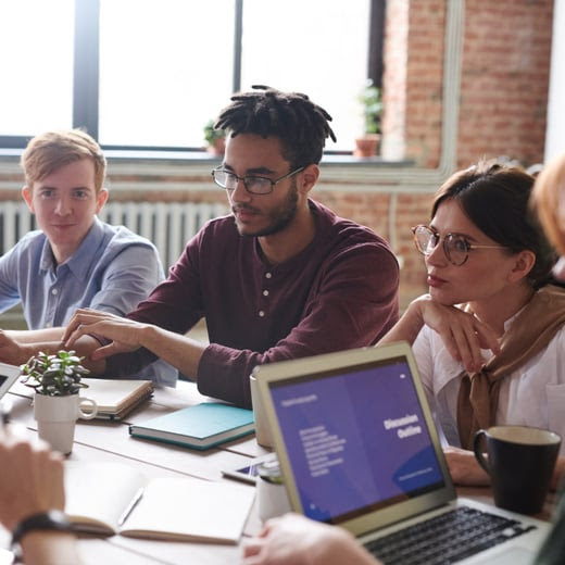 Coworkers reengaging with work during a meeting