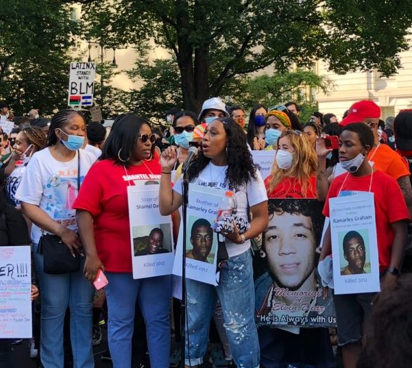 Photo of Constance Malcolm and other families of New Yorkers killed by the NYPD speaking at a rally