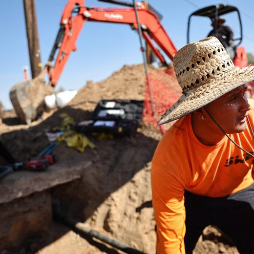 BAKER, CALIFORNIA - JULY 10: (L-R) Oscar Rodriguez, Jose Delgado and Jesus Rodriguez work in the afternoon triple-digit heat during a long-duration heat wave which is continuing to impact much of California on July 10, 2024 in Baker, California. The heat dome has driven extreme temperatures with at least 12 California cities breaking all-time heat records while numerous wildfires have been sparked around the state. Mario Tama/Getty Images/AFP (Photo by MARIO TAMA / GETTY IMAGES NORTH AMERICA / Getty Images via AFP)