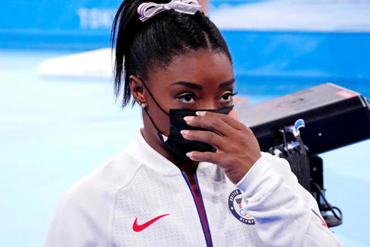 Simone Biles (USA) looks on after pulling out of the women's team final during the Tokyo 2020 Olympic Summer Games at Ariake Gymnastics Centre.