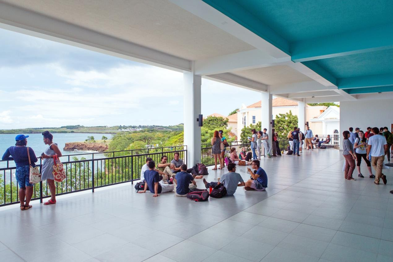 Students relax in the open air of Modical Hall