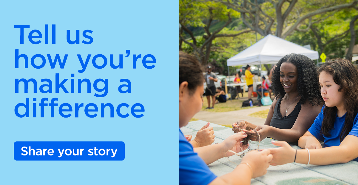On the right, four people of varied skintones are sitting at a picnic table outside and exchanging craft supplies. On the left, the words "Tell us how you're making a difference, share your story"