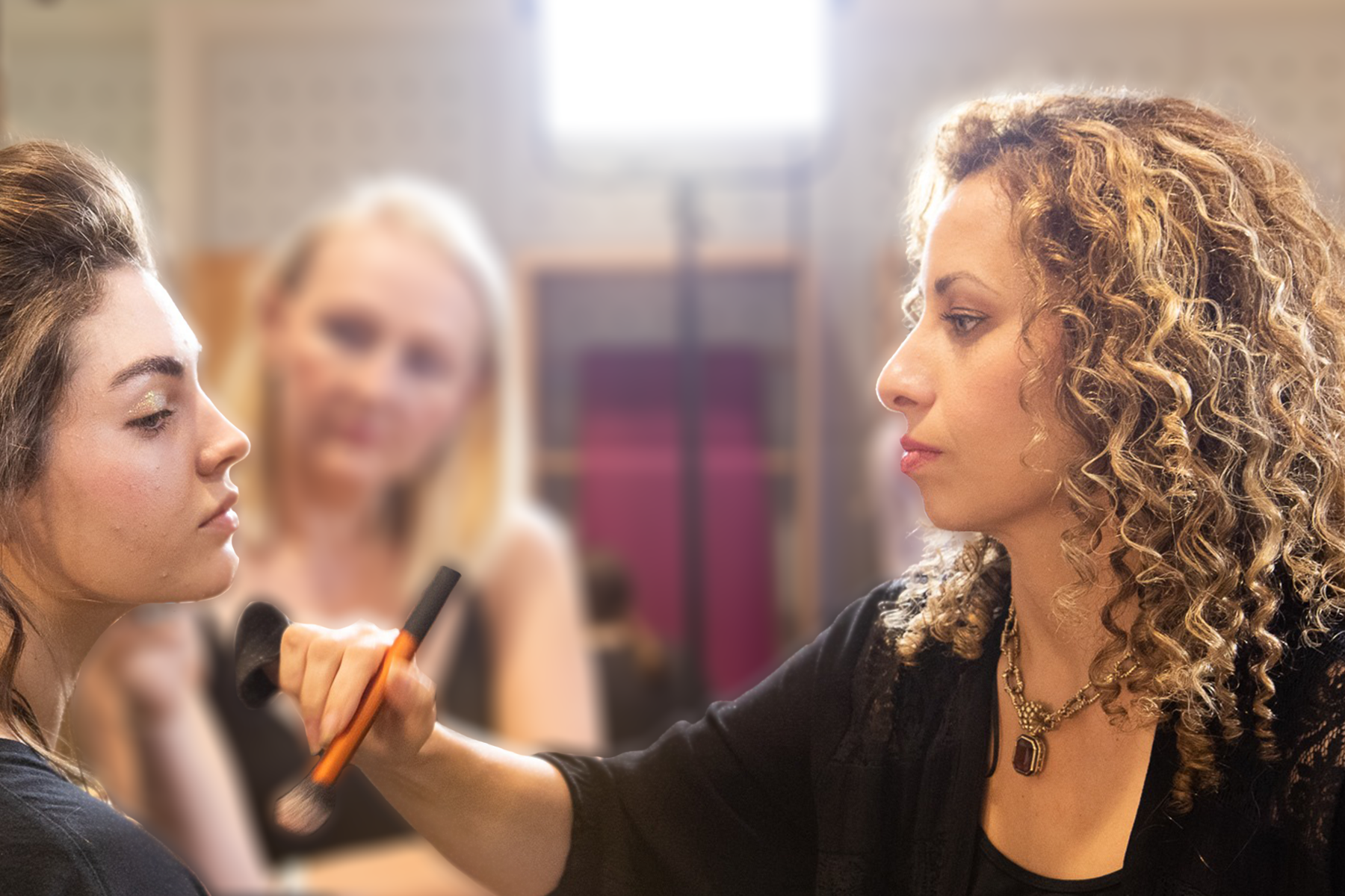 Jules De Jesús Fritz applying makeup at SCAD Fashion Show Savannah 2019 