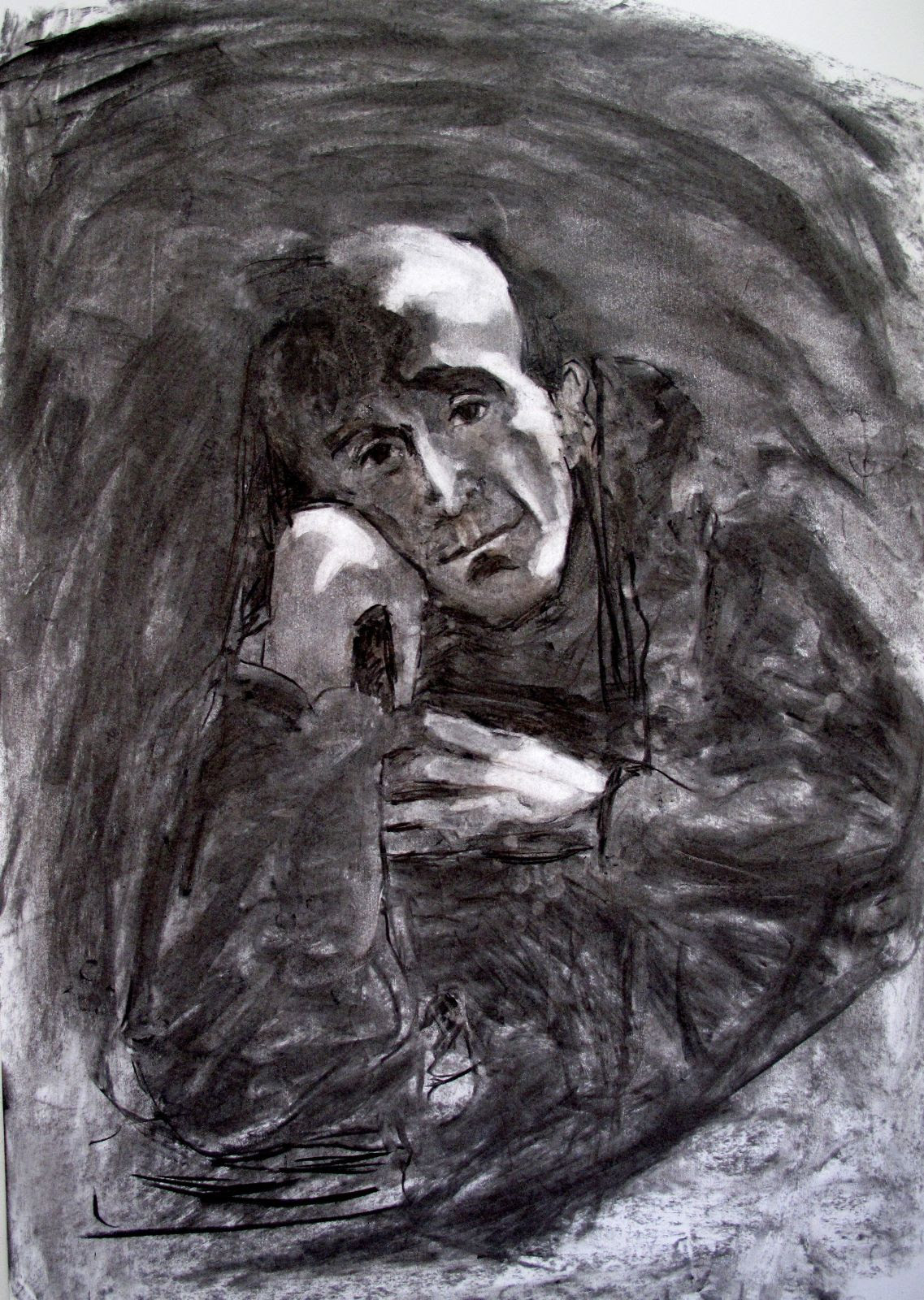 A charcoal drawing of a man resting the side of his head on his right hand, gazing out at us with an ambiguous mix of tenderness and watchfulness. He is surrounded by a swirling blackness.