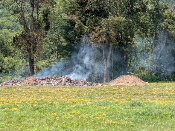 Illegal solid waste pile burns in town of Genesee