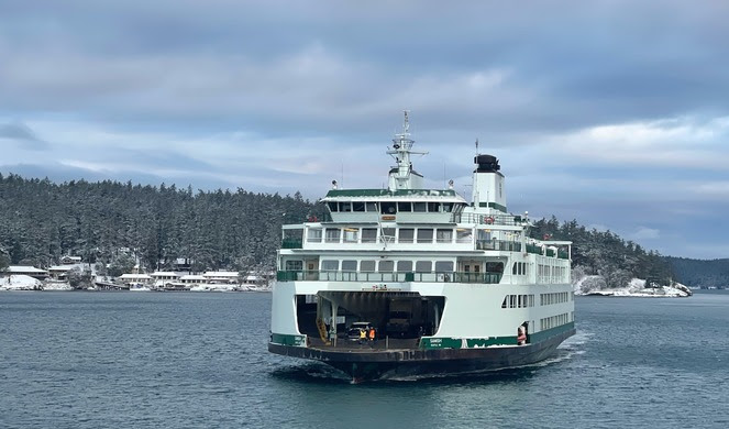 Ferry Samish in the water with a snowy background