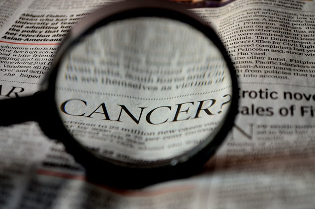 cancer under magnifying glass