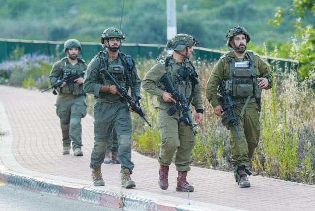 SECURITY FORCES are on the scene in the Druze village of Hurfeish in the Upper Galilee after a drone attack. (photo credit: AYAL MARGOLIN/FLASH90)