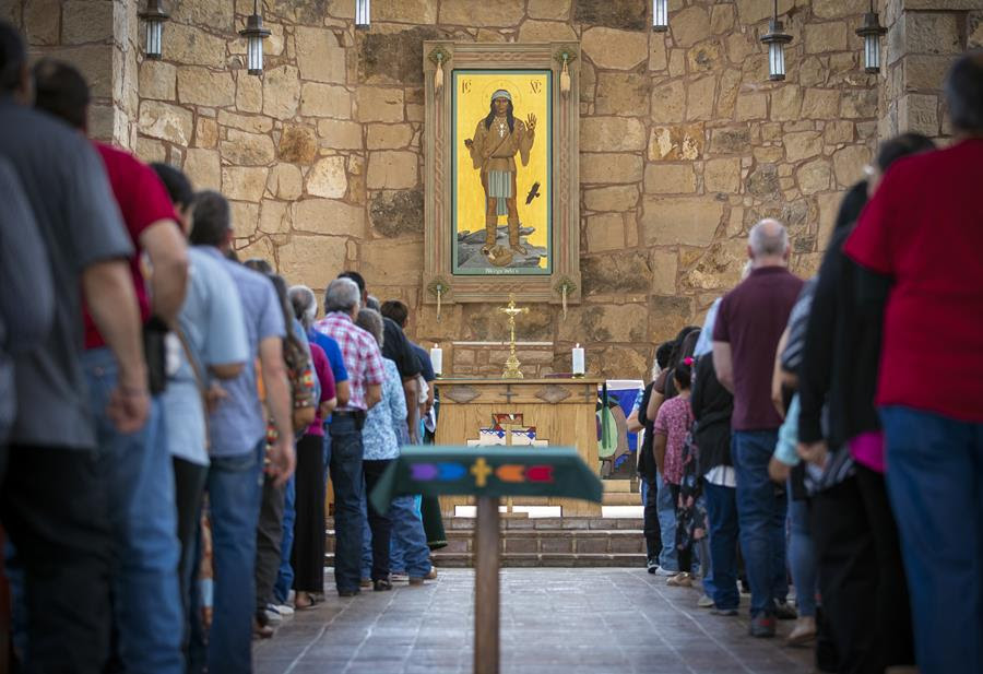 An image of Jesus Christ portrayed as an Apache man hanging in a church.