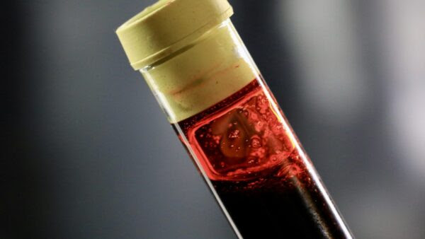 Photograph of a phial of human blood.