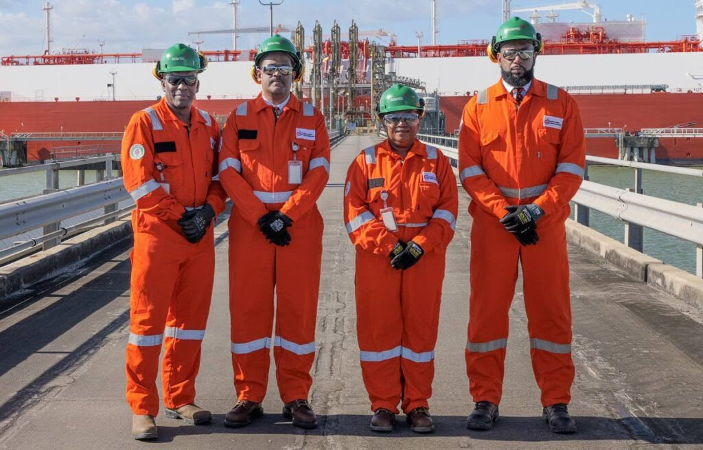 NGC executives, from left, VP operations Ian Walcott; acting president Edmund Subryan; VP commercial Verlier Quan-Vie and chairman Dr Joseph Ishmael Khan stand in front of the first cargo of liquefied natural gas (LNG) from Atlantic’s Trains Two and Three at its facility in Point Fortin recently. - Photo courtesy NGC