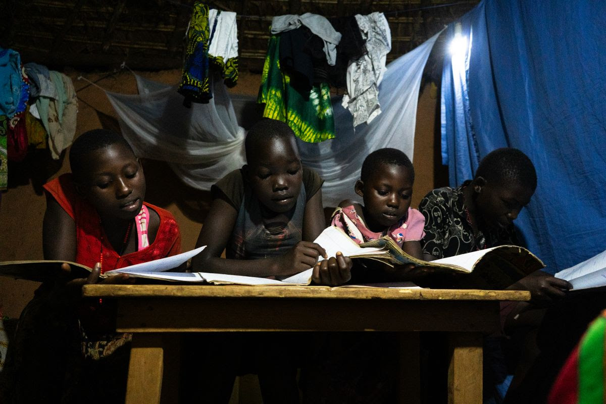 Children studying with lights