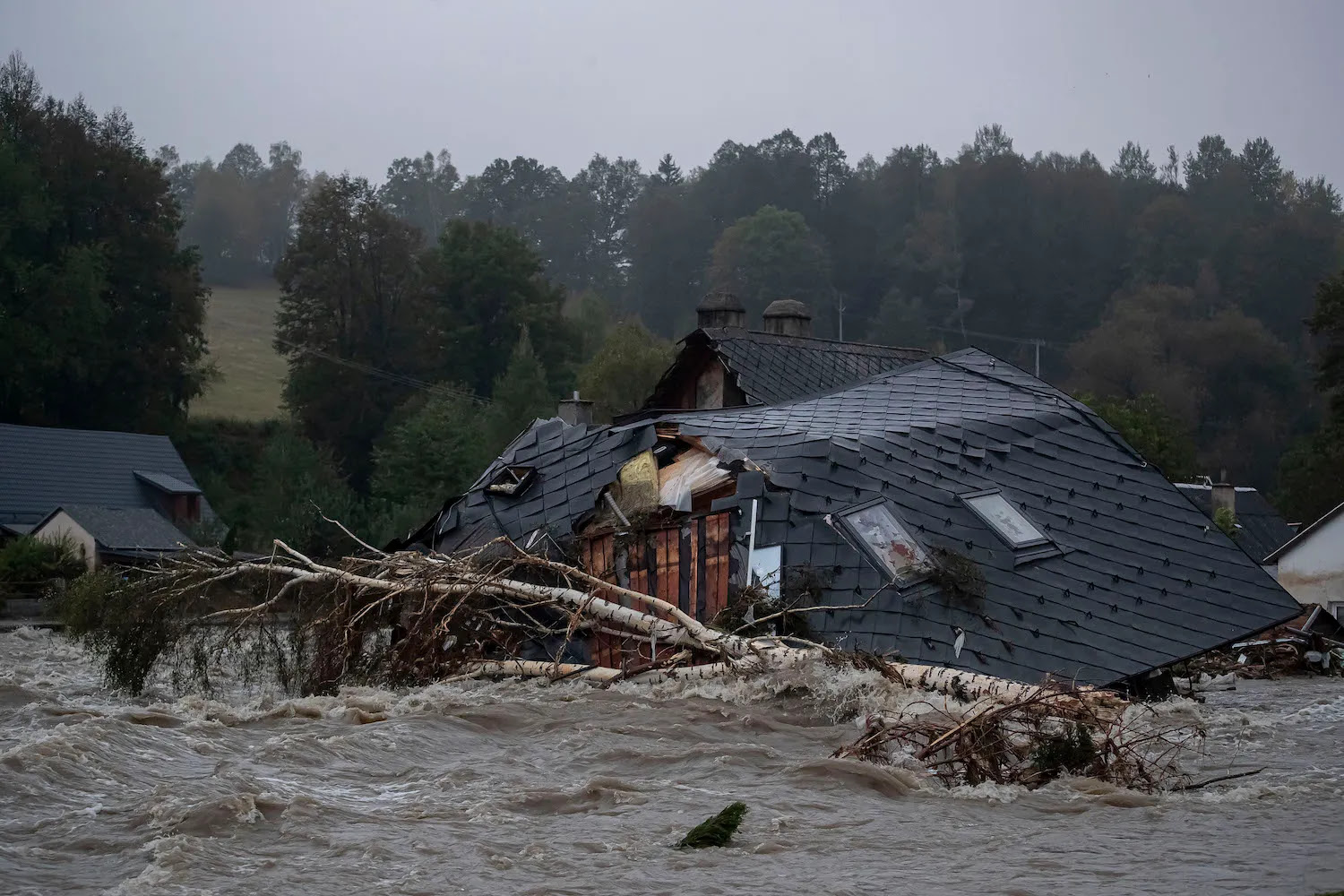 Properties are damaged as floodwaters rise following heavy rain in the Czech Republic.