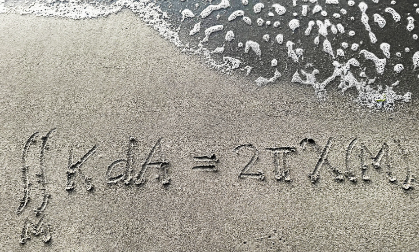 A mathematical formula written in the sand