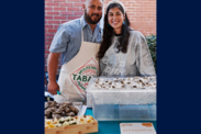 Owners of DJ Oyster Company, smile in front of some of their Matagorda Pearl farmed oysters (Courtesy of DJ Oyster Company.)