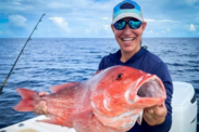 Recreational angler holds up a red snapper caught in the Gulf of Mexico. Credit: Grayson and Shelley Shepard