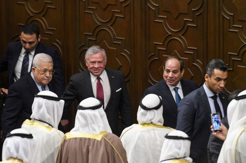 Palestinian President Mahmoud Abbas, Jordan's King Abdullah II, and Egyptian President Abdel Fattah al-Sisi talk to delegates during the Arab League's Summit for Jerusalem in Cairo, on Feb. 12, 2023.