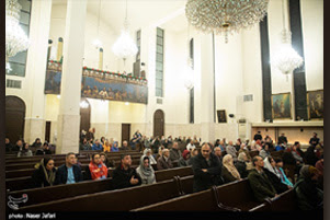 People are gathered in a large church.