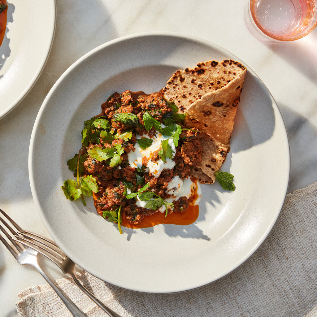 A top-down view of beef keema (spiced ground beef topped with cilantro).