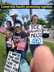 family with signs on June 14