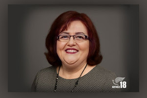 Lida Alexani is smiling.