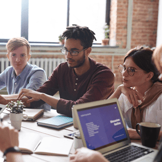 Coworkers tackling new project during meeting