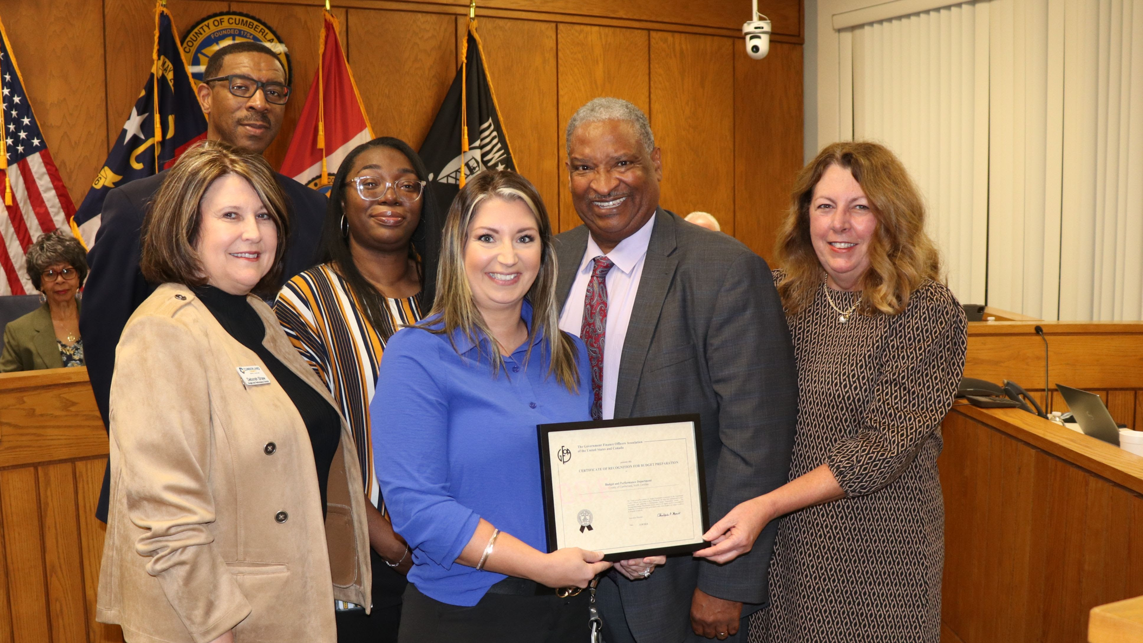 The Budget and Performance Department accepts the GFOA Distinguished Budget Presentation Award during the Board of Commissioners Regular Meeting November 18, 2024. Pictured (left to right): Budget and Performance Director Deborah Shaw, County Manager Clarence Grier, Budget and Management Analyst II Gathany Smith, Budget and Management Analyst II Ashley Brewington, Chairman Glenn Adams and Senior Budget and Management Analyst Denise Urban. 