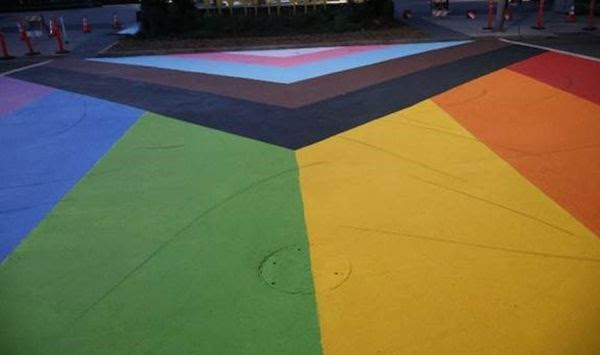 An adult and two minors were arrested and booked on malicious mischief on June 5, 2024, for using their Lime motorized e-scooters to leave skid marks on the Pride crosswalk at Riverfront Park in Spokane, Washington. (Spokane Police Department photo)