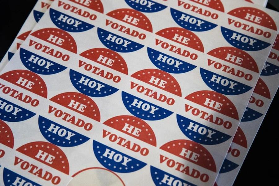 A sheet of stickers that say "He Votado Hoy."