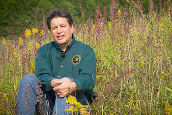 The DNR's deputy public information officer is shown being interviewed.