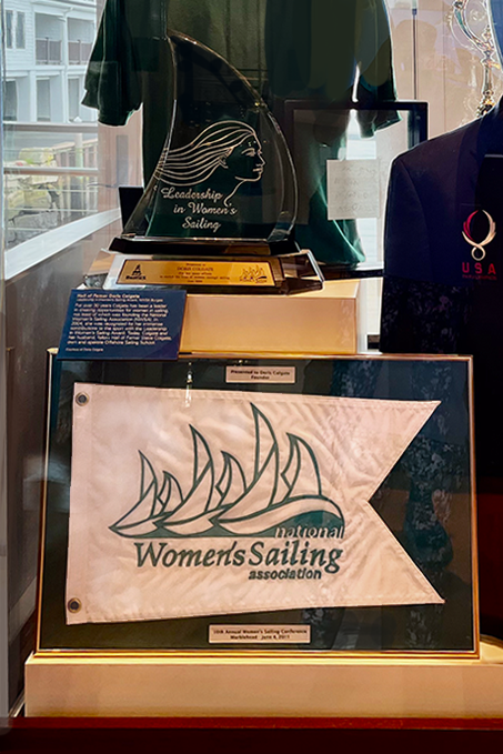 Doris Colgate's display at the National Sailing Museum features her Leadership in Women's Sailing Award along with a NWSA burgee.