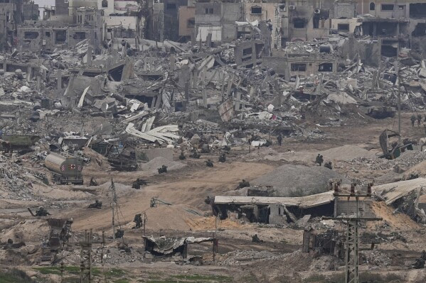 Israeli troops take positions in the Gaza Strip as seen from southern Israel, Thursday, Dec. 21, 2023.  (AP Photo/Ohad Zwigenberg, File)