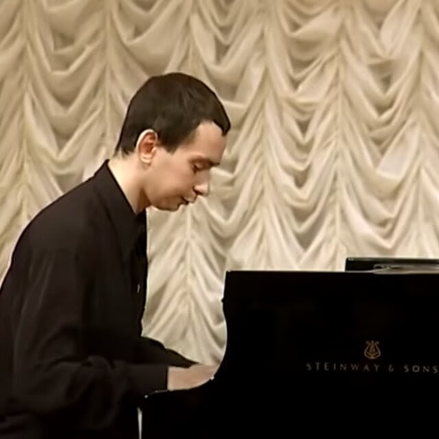 A man sitting at a piano.