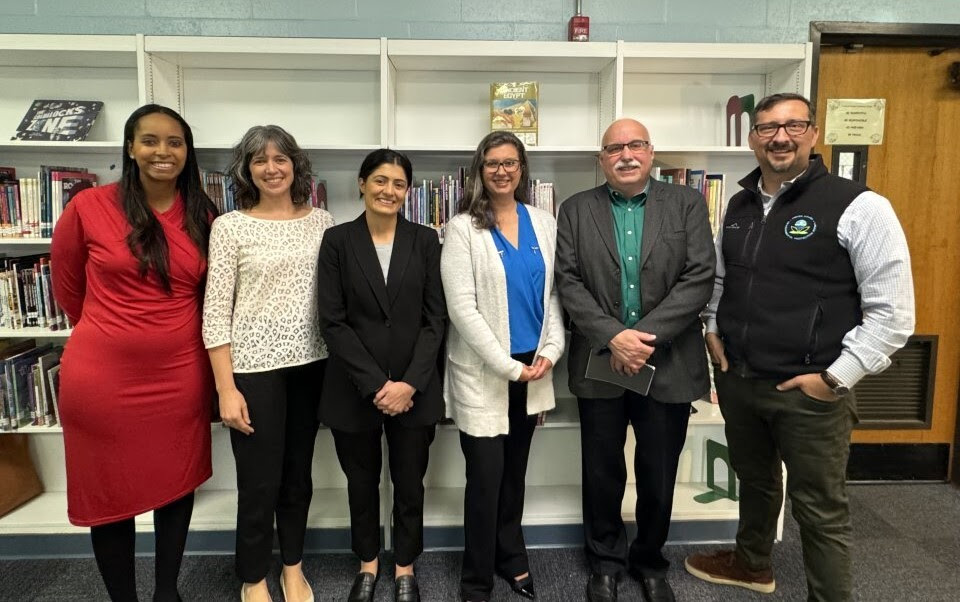 Grantee representatives and EPA leadership in a school library