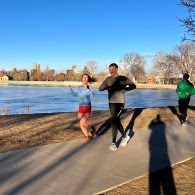 two people running outside smiling