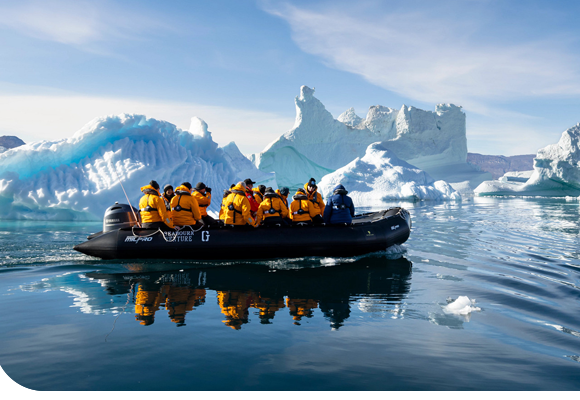Zodiac ride past iceberg in Greenland