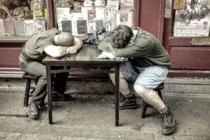 Two lads napping at the pub