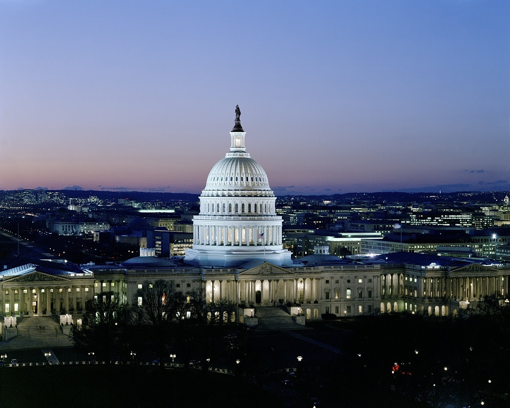 Capitol building against sky at dusk.