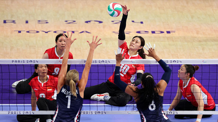 Yixiao Xu of Team China strikes the ball against Team United States during the Women's Preliminary Round - Pool A Match 3 at the Paris 2024 Paralympic Games. ©Michael Reaves/Getty Images