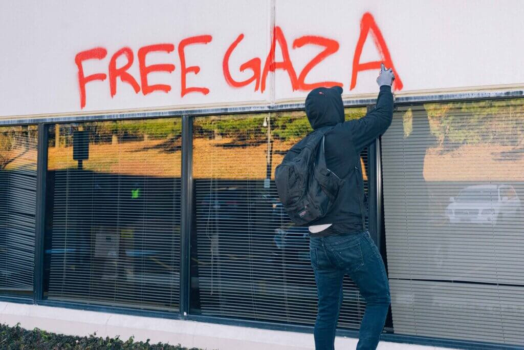 Palestine Action activists spray paint 'Free Gaza' on the front of the Elbit Systems building in Merrimack, New Hampshire (Photo: Maen Hammad)