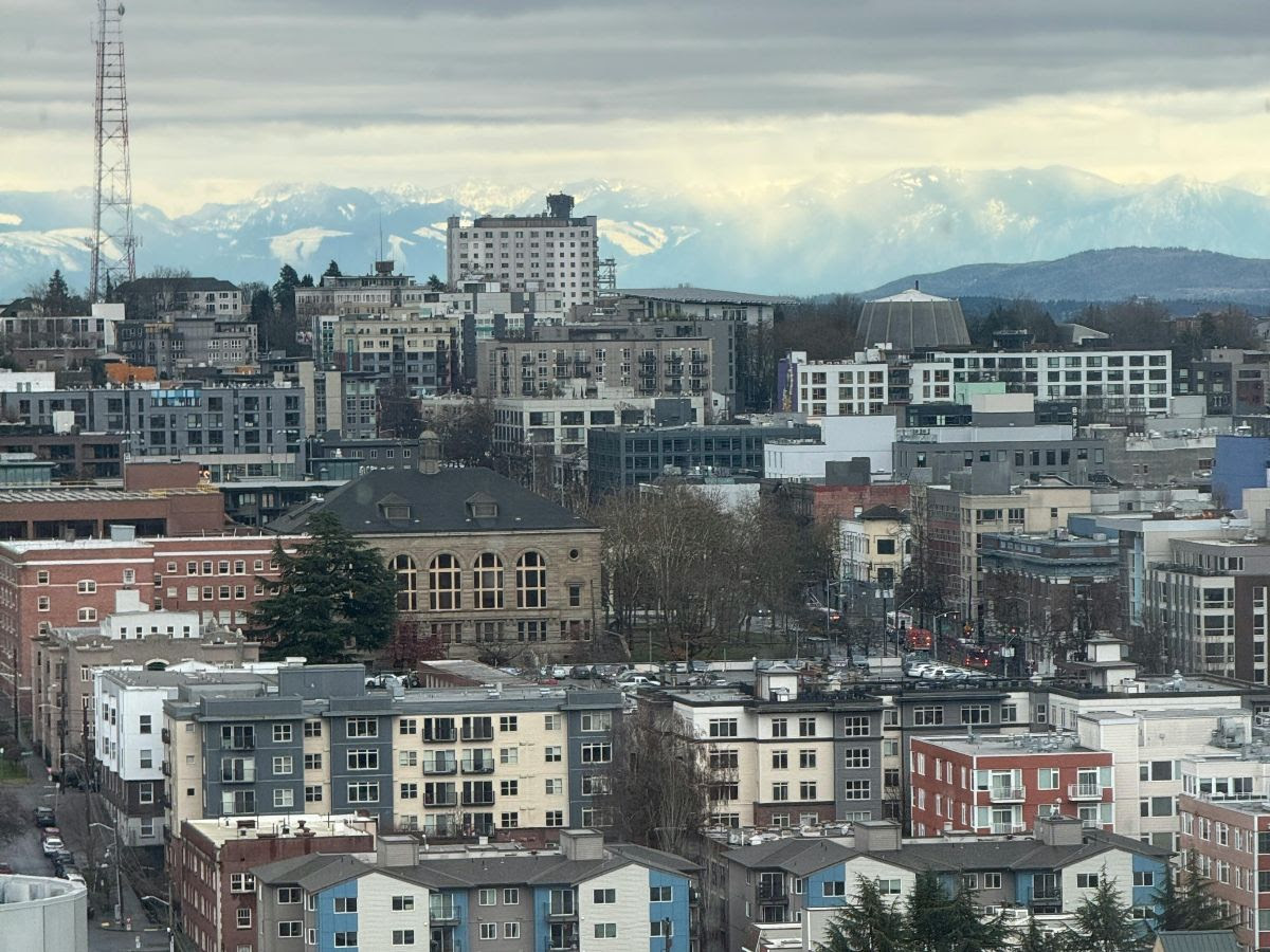 Rows of houses in the winter with mountains in the background