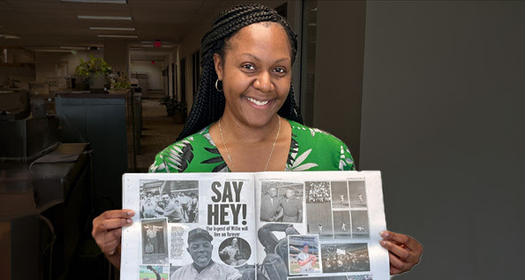 LaKeshia Motley, of OSC Executive Communications and Correspondence, proudly displays the NY Daily News’s tribute to her late great uncle